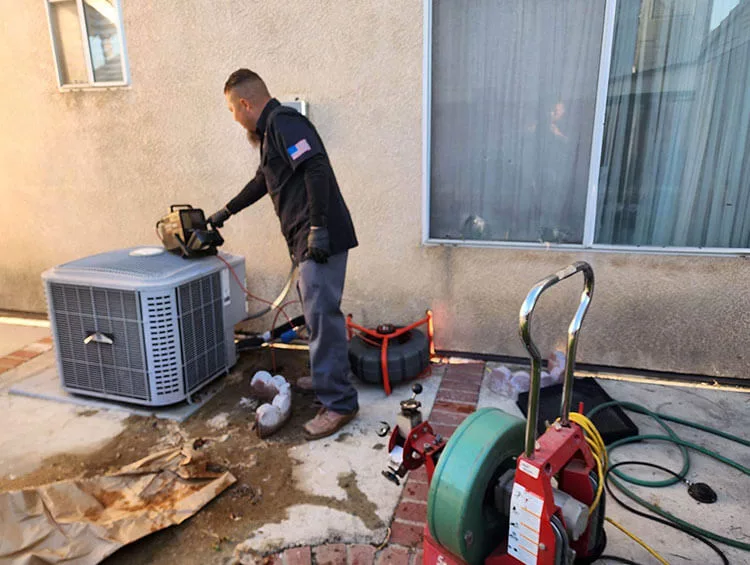 RD Plumbing technician performing sewer cleaning